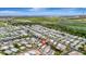 Aerial view of a waterfront community with canals, single-Gathering homes, and access to the water at 134 W Saint Annes Cir, Apollo Beach, FL 33572