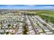 An aerial view showcases a vibrant community with waterways and neatly arranged mobile homes at 134 W Saint Annes Cir, Apollo Beach, FL 33572