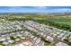 An aerial view showcases a vibrant waterfront community and neatly arranged mobile homes at 134 W Saint Annes Cir, Apollo Beach, FL 33572