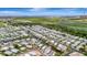 An aerial view showcases a vibrant waterfront community and neatly arranged mobile homes at 134 W Saint Annes Cir, Apollo Beach, FL 33572