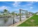 Waterfront view featuring boat lift and canal at 134 W Saint Annes Cir, Apollo Beach, FL 33572