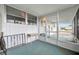 Outdoor lanai with a vintage desk and an exterior staircase at 134 W Saint Annes Cir, Apollo Beach, FL 33572