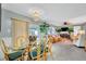 Open concept living and dining area with rattan furniture and lots of natural light at 134 W Saint Annes Cir, Apollo Beach, FL 33572