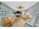 Bright living area with ample seating and a cozy fireplace at 134 W Saint Annes Cir, Apollo Beach, FL 33572