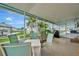 Spacious, screened patio features seating and waterfront views at 134 W Saint Annes Cir, Apollo Beach, FL 33572