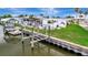 Waterfront home features a private boat lift for easy access to the water at 134 W Saint Annes Cir, Apollo Beach, FL 33572