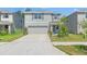 Charming two-story home with a neat lawn and a two-car garage, providing curb appeal at 13765 Whiskey Daisy Dr, Dade City, FL 33525