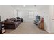 Spacious living room with plush carpeting, bright windows, and plenty of room for entertaining at 13765 Whiskey Daisy Dr, Dade City, FL 33525
