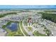 Aerial view of the neighborhood with well-maintained homes and landscaping at 1398 Crescent Hoop Way, Wesley Chapel, FL 33543