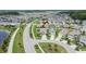Aerial view of homes in neighborhood with ponds at 1398 Crescent Hoop Way, Wesley Chapel, FL 33543