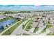 Beautiful aerial view of a single-Gathering home with solar panels in a desirable neighborhood with a pond at 1398 Crescent Hoop Way, Wesley Chapel, FL 33543