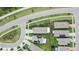 Community aerial view showcasing houses, roads, and a picturesque pond at 1398 Crescent Hoop Way, Wesley Chapel, FL 33543