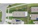 Aerial view of the backyard of a house and the nearby streets and community at 1398 Crescent Hoop Way, Wesley Chapel, FL 33543