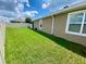 Fenced backyard with healthy green grass, offering privacy and space for outdoor activities at 1398 Crescent Hoop Way, Wesley Chapel, FL 33543