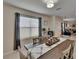 Bright dining area with contemporary decor and large window, creating an inviting space for meals at 1398 Crescent Hoop Way, Wesley Chapel, FL 33543