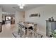Cozy dining area with a modern table setting and natural lighting, perfect for casual meals and gatherings at 1398 Crescent Hoop Way, Wesley Chapel, FL 33543