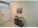 Light and bright entryway with tile floors, a decorative cabinet, and a charming piece of wall art at 1398 Crescent Hoop Way, Wesley Chapel, FL 33543