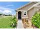 Charming front entrance featuring a well-manicured lawn and inviting doorway at 1398 Crescent Hoop Way, Wesley Chapel, FL 33543