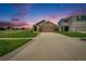 Charming one-story home with a well-maintained lawn and a spacious driveway, perfect for suburban living at 1398 Crescent Hoop Way, Wesley Chapel, FL 33543