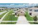 An inviting home with a manicured lawn and a convenient two-car garage at 1398 Crescent Hoop Way, Wesley Chapel, FL 33543