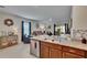 Kitchen featuring an island with granite countertops and stainless steel appliances at 1398 Crescent Hoop Way, Wesley Chapel, FL 33543