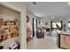 Open-concept living space with pantry, leading to the patio, designed for modern living and entertaining at 1398 Crescent Hoop Way, Wesley Chapel, FL 33543