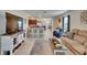 Spacious living room with open floor plan and updated kitchen at 1398 Crescent Hoop Way, Wesley Chapel, FL 33543