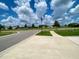 Picturesque street view, highlighting the neighborhood's serene environment and well-maintained sidewalks at 1398 Crescent Hoop Way, Wesley Chapel, FL 33543