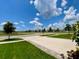 Beautiful street view showcasing lush green lawns and well-maintained landscaping at 1398 Crescent Hoop Way, Wesley Chapel, FL 33543