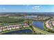 Beautiful aerial view of the waterfront community with lush landscaping and serene water features at 15860 Aurora Lake Cir, Wimauma, FL 33598