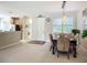 Open-concept dining space adjoining the foyer and showcasing a glimpse of the modern kitchen at 15860 Aurora Lake Cir, Wimauma, FL 33598