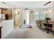Inviting entryway showcasing the dining area and a glimpse of the modern kitchen at 15860 Aurora Lake Cir, Wimauma, FL 33598
