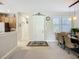 Welcoming foyer leading to the dining area and kitchen with stylish decor at 15860 Aurora Lake Cir, Wimauma, FL 33598