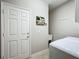 Laundry room with a white door, washer, utility sink, and neutral paint at 15860 Aurora Lake Cir, Wimauma, FL 33598