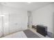 Bright bedroom featuring neutral decor, a double door closet, and sleek black dresser for storage and functionality at 17668 Bright Wheat Dr, Lithia, FL 33547
