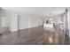 Expansive open-concept living area features sleek flooring, neutral tones, and ample natural light at 17668 Bright Wheat Dr, Lithia, FL 33547