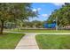 Well-maintained community playground with swings and slides offers a safe and fun area for children at 17668 Bright Wheat Dr, Lithia, FL 33547