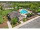 Aerial view of community pool and clubhouse, showcasing the spacious layout at 17668 Bright Wheat Dr, Lithia, FL 33547