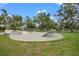 Community skatepark with ramps and concrete features offers a dedicated space for skateboarding enthusiasts at 17668 Bright Wheat Dr, Lithia, FL 33547