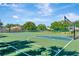 Outdoor basketball court with blue and green surfaces, featuring multiple hoops and ample space for play at 1806 Powder Ridge Dr, Valrico, FL 33594