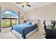 Bedroom featuring a large window, a comfy bed, and a workspace for studying or working at 1806 Powder Ridge Dr, Valrico, FL 33594