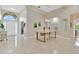 Open-concept living space with dining area featuring modern light fixture at 1806 Powder Ridge Dr, Valrico, FL 33594