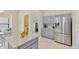 Modern kitchen with stainless steel appliances, granite countertops, and gray cabinets at 1806 Powder Ridge Dr, Valrico, FL 33594