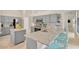 Spacious kitchen featuring granite countertops, stainless steel appliances, and a breakfast bar at 1806 Powder Ridge Dr, Valrico, FL 33594
