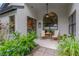 Covered patio with comfortable seating, a ceiling fan, and views of the landscaped yard at 1806 Powder Ridge Dr, Valrico, FL 33594