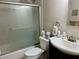 Well-lit bathroom featuring a frosted glass shower door and a modern sink at 2060 Marilyn St # 121, Clearwater, FL 33765