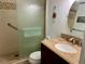 Bathroom with glass enclosed shower, updated vanity, and decorative accents at 2060 Marilyn St # 121, Clearwater, FL 33765