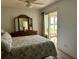 Cozy bedroom with sliding glass doors leading to outdoor patio seating area at 2060 Marilyn St # 121, Clearwater, FL 33765