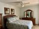 Comfortable bedroom with ceiling fan and wooden dresser at 2060 Marilyn St # 121, Clearwater, FL 33765