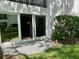 Ground floor patio view, with sliders open to the living area and a garden area at 2060 Marilyn St # 121, Clearwater, FL 33765